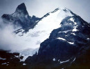 38 glacier peaking through the clouds in chile 800