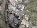 39 mayan face carved in stone at tikal